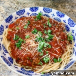 Rich, hearty, homemade slow cooker spaghetti sauce served with spaghetti noodles