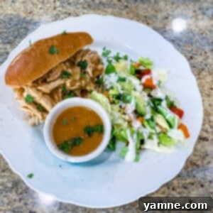 Delicious Hawaiian Chicken Sandwiches stacked with pineapple and BBQ sauce on a bun