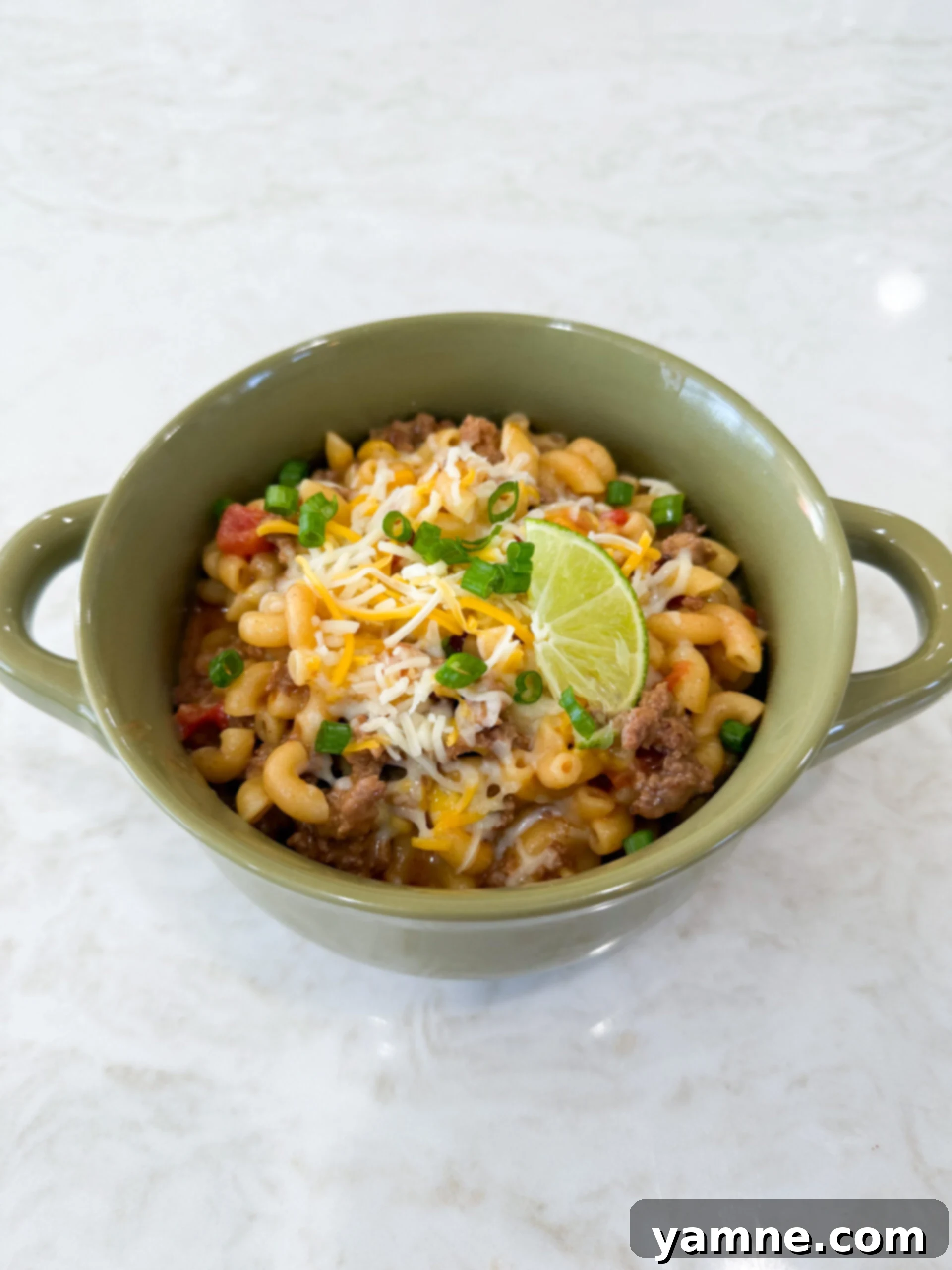 Easy Taco Pasta One Pot Skillet Dinner in a bowl ready to eat, garnished with cilantro.