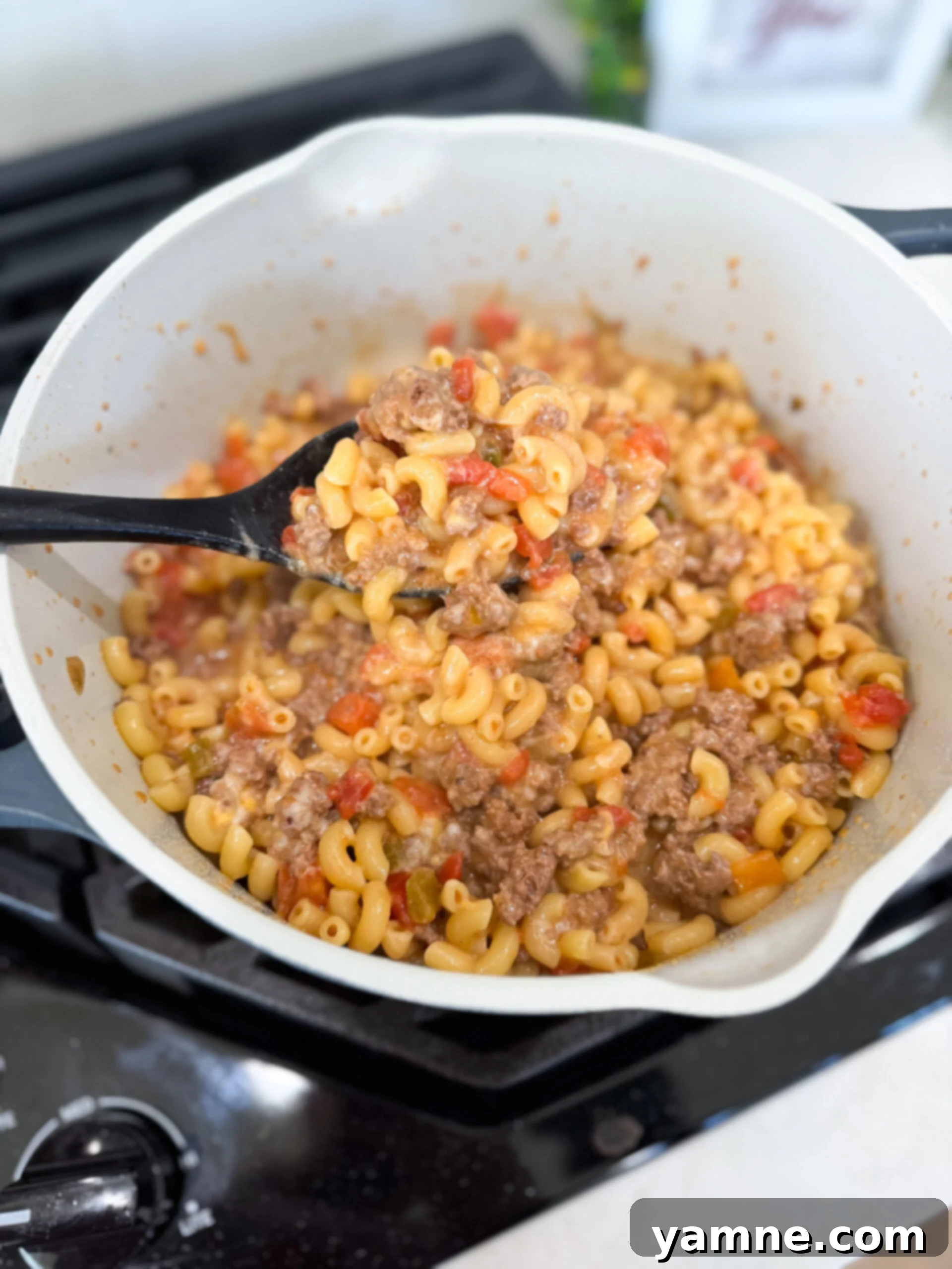Cooked taco pasta ready to be served hot in a skillet.
