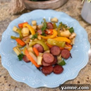 Sheet Pan Sausage and Vegetables 2 Sheet pan with roasted sausage, bell peppers, onions, carrots, and potatoes