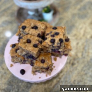 Delicious and healthy blueberry breakfast cake with a drizzle of maple syrup.