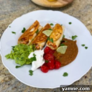 Crispy Loaded Flour Taquitos 2 Golden-brown Flour Tortilla Loaded Taquitos filled with chicken, cheese, and salsa, garnished with fresh green onions