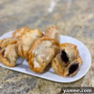 Delicious Blueberry Hand Pies drizzled with sweet glaze
