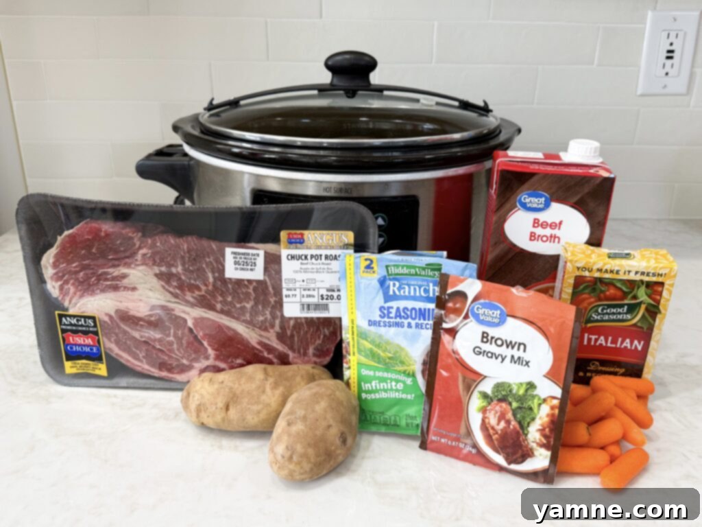 Perfect Slow Cooker Pot Roast 3 A vibrant collection of ingredients for making slow cooker pot roast, including beef, onions, carrots, potatoes, and seasoning packets