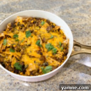 Delicious one-pan enchiladas topped with fresh cilantro and sour cream.