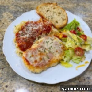 Baked Chicken Parmesan 2 Crispy Oven Baked Chicken Parmesan topped with rich marinara and melted mozzarella