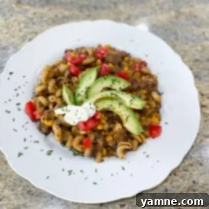 Cheesy Beef Taco Pasta Skillet 2 Delicious One-Pot Beef & Cheese Taco Pasta in a large pot, ready to serve
