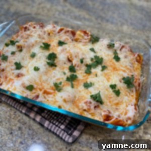 Delicious baked tortellini dish with melted cheese and fresh parsley garnish
