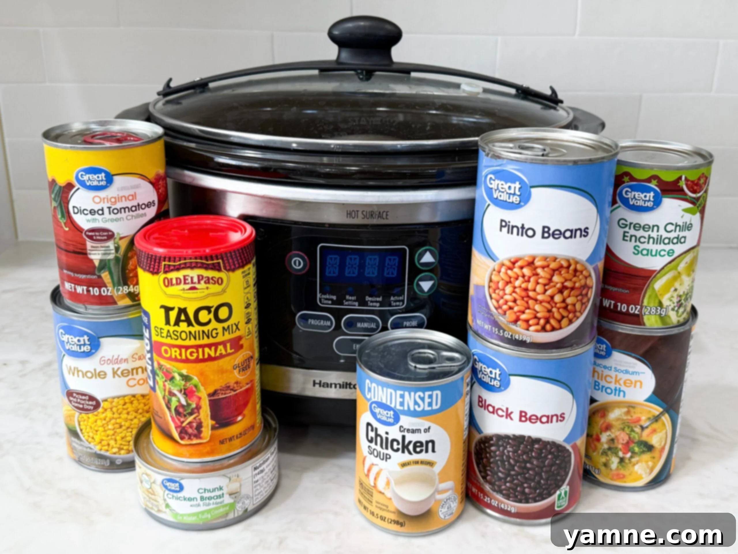 8 canned ingredients for taco soup lined up on countertop