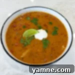 Easy Slow Cooker Pork Chops and Rice 4 A bowl of rich, cheesy Queso Chili ready to be served.