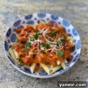 Delicious Creamy Tomato and Spinach Pasta served in a bowl