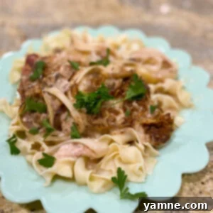 Delicious slow cooker pork chops in a creamy sauce, ready to serve