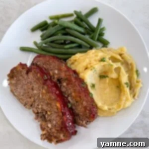 Simple Meatloaf, freshly baked with a savory-sweet glaze.