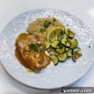 Caramelized Brown Sugar Pork Chops 2 Perfectly seared brown sugar glazed pork chops with a shiny, sweet-savory sauce on a plate