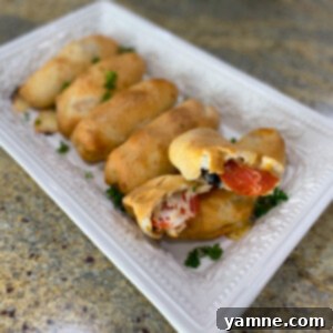 Delicious homemade pizza rolls with fluffy dough and melted cheese, ready to eat.