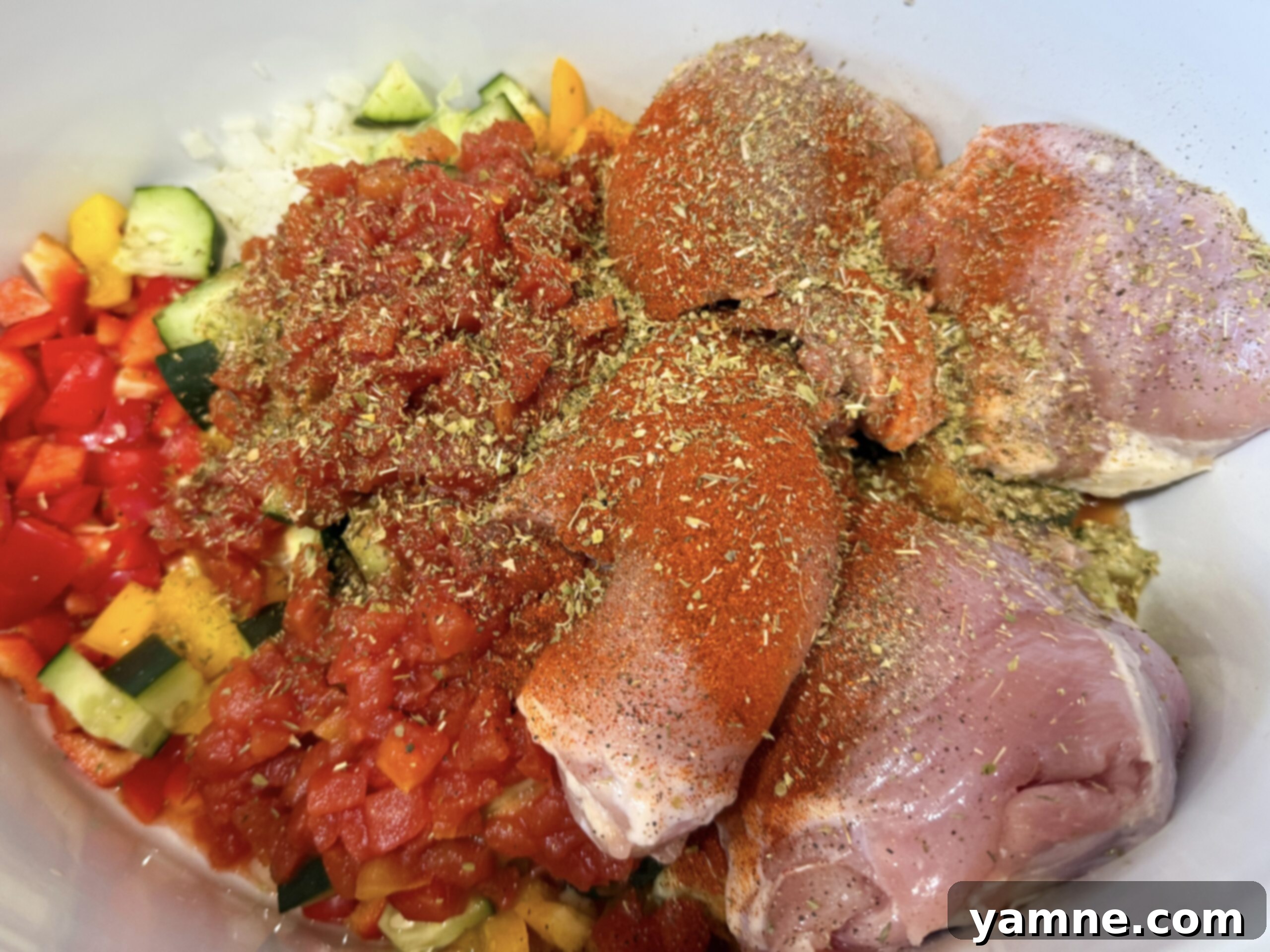 All of the ingredients beautifully layered in the slow cooker, ready to cook into a delicious meal.