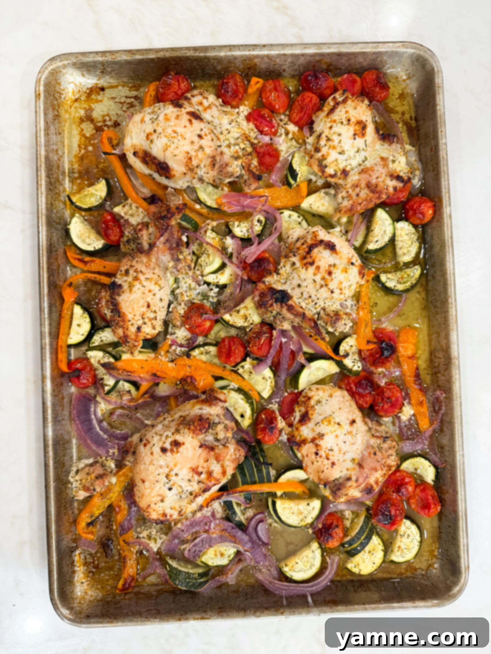 Greek chicken dinner on sheet pan