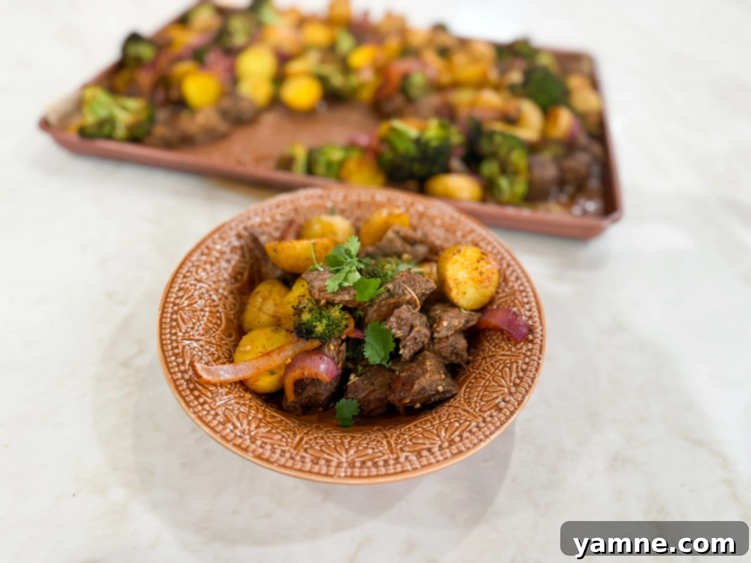 Garlic Butter Steak Bites with Roasted Veggies 2 Garlic butter steak bites and roasted vegetables served family style