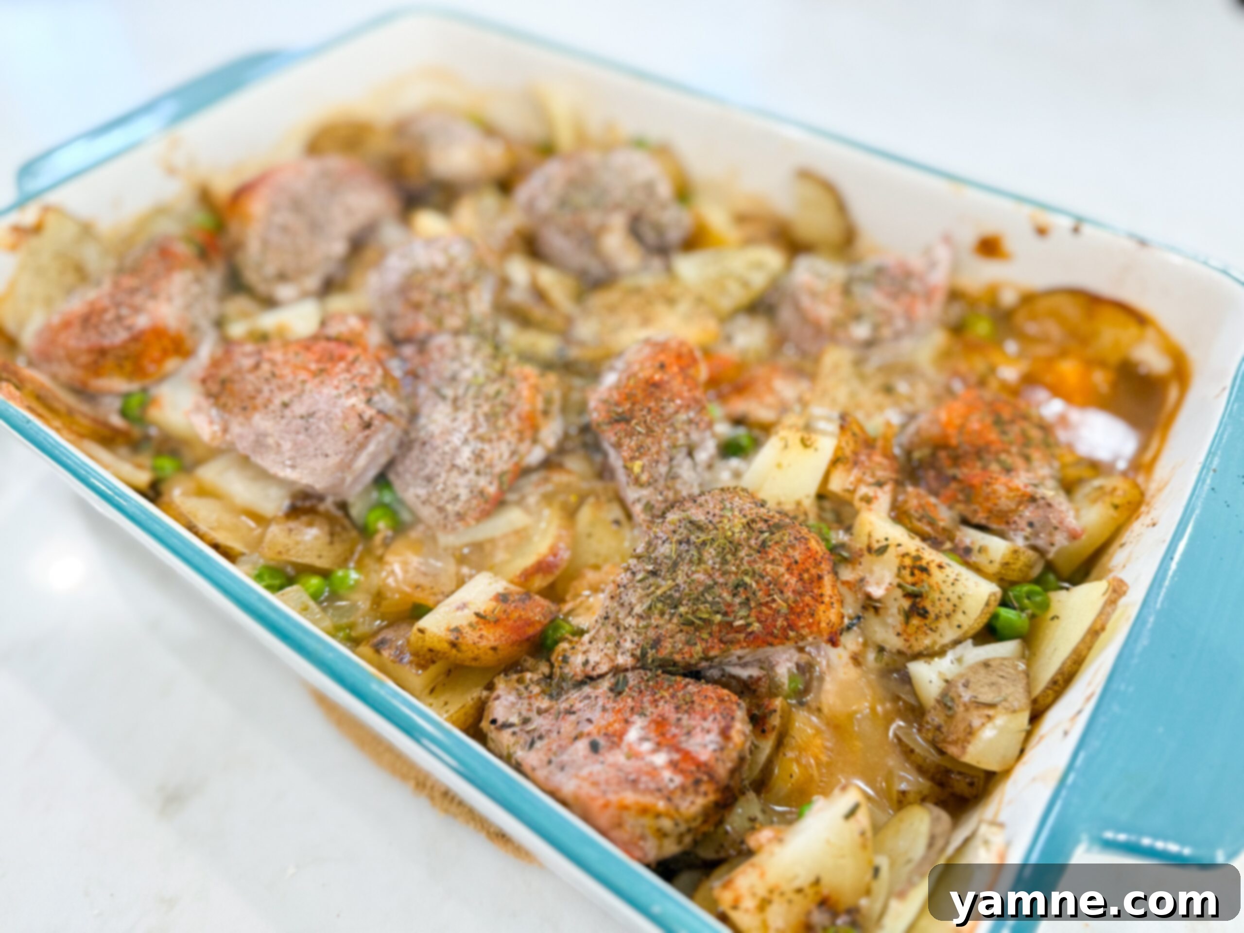 Pork chop and potato casserole baked in a creamy sauce. A classic pork chop and potato casserole made with pantry staples.
